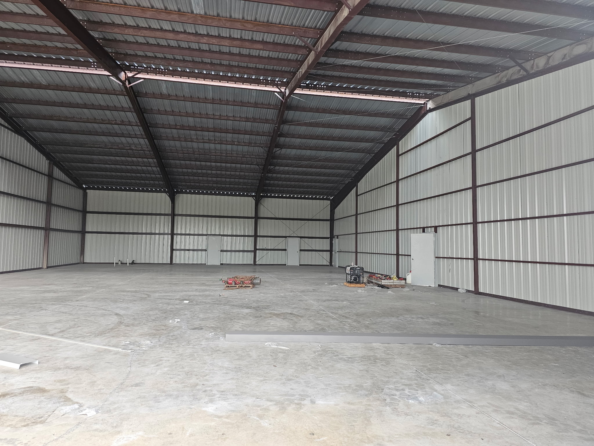 Commercial steel building interior open span wide view by KC Construction in Central Texas