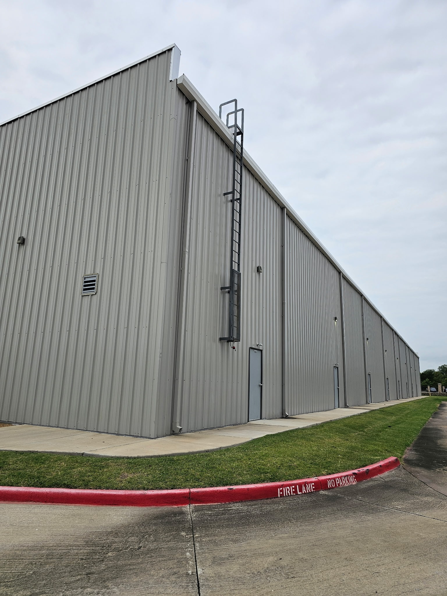 Commercial steel building side elevation exterior by KC Construction