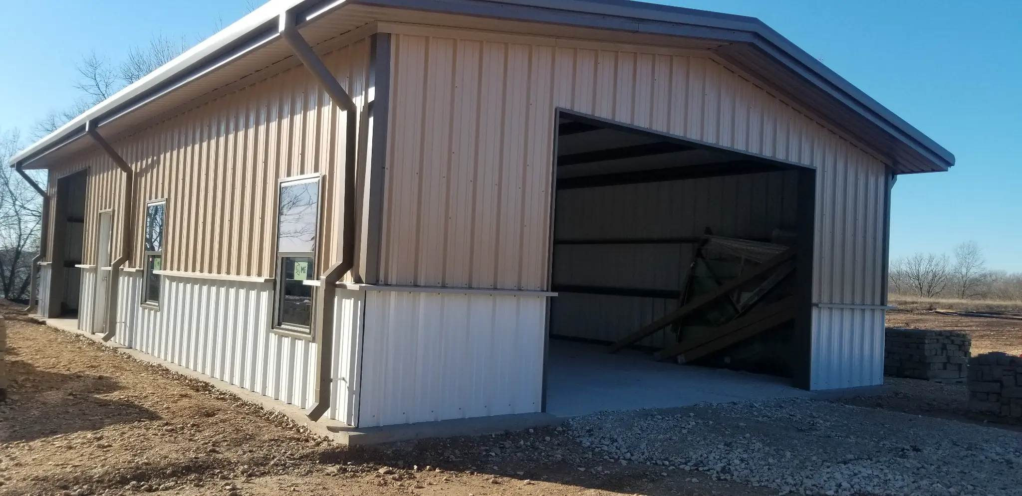 Small commercial shop exterior steel building by KC Construction in Central Texas